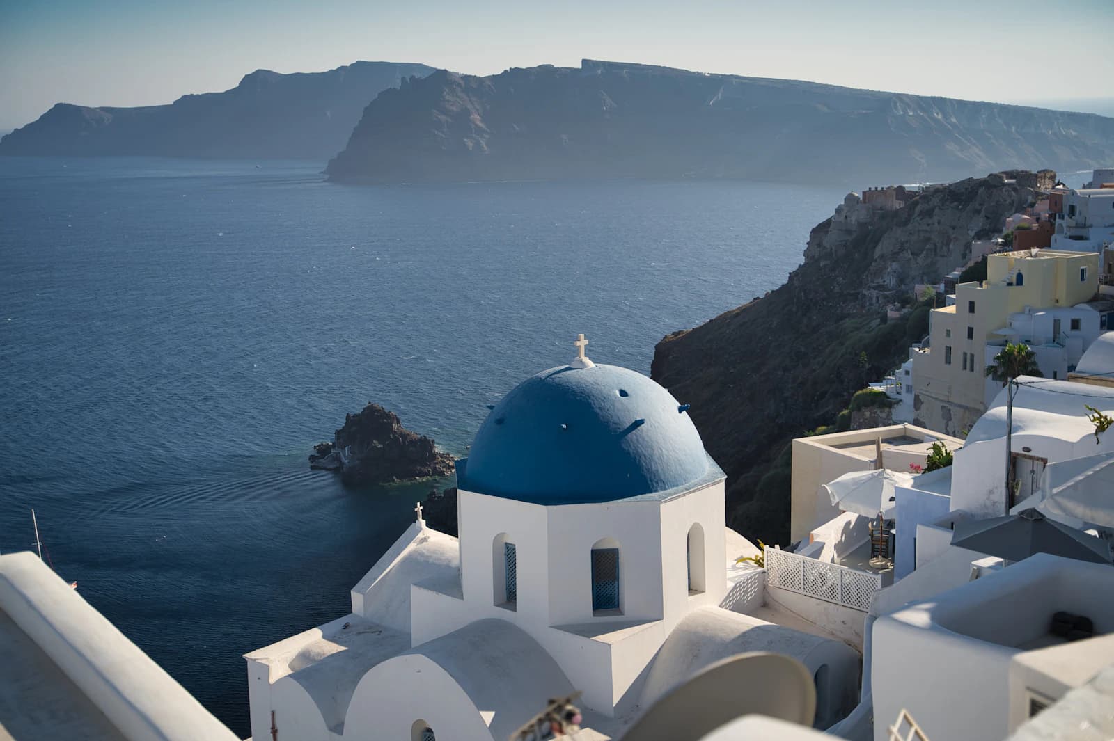 Blue-domed church and white houses in Oia, Santorini